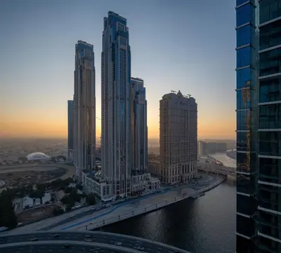 an aerial view of a city with tall buildings at 2BR Luxury Retreat - Stunning Canal and Sea View in Dubai