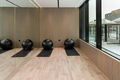 a row of black balls sitting in a room at Furnished 1br In Jvc Pool Access Free Parking in Dubai