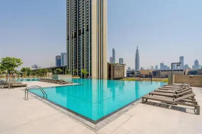 a swimming pool on the roof of a building at Prime Location Full Burj View in Downtown Dubai in Dubai