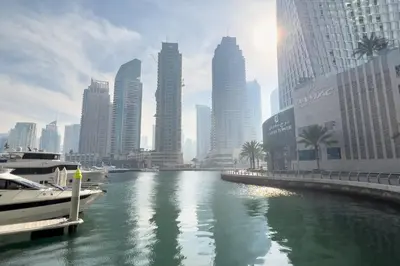 a river in a city with tall buildings at GuestReady - Charm stay in Dubai Marina in Dubai