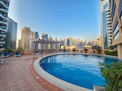 a large swimming pool on top of a building at EasyGo- Comfy STU in Dubai Marina -Zum04 in Dubai