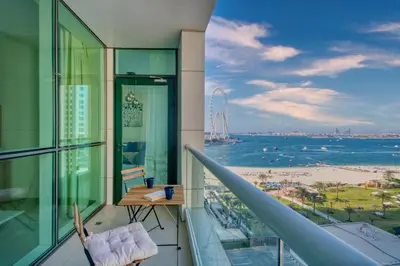 a balcony with a view of the ocean at Classic Retreat in JBR with Private Beach Access in Dubai