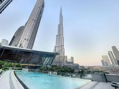 a swimming pool with a view of a city at Grande Residence - Contemporary One Bedroom in Dubai