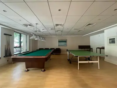 a billiard room with a table and a pool at Luxury High Floor 1BR with Full Burj Khalifa View by Auberge in Dubai