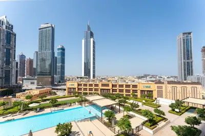 a view of a city skyline with a swimming pool at 2 Br in in Burj Crown by Pk Holidays in Dubai