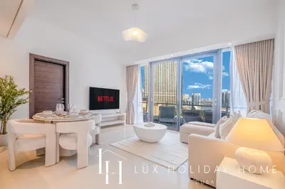 a living room with a view of the city at LUX The Silverene Marina View Suite 4 in Dubai