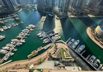 an aerial view of a marina with boats in the water at Livbnb - 2BR Apartment with Breathtaking Marina View in Dubai