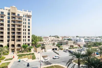 an aerial view of a city with a parking lot at Frank Porter - Lamtara 3 in Dubai