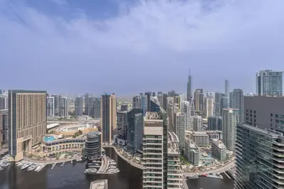 an aerial view of a city with tall buildings at JBR Marina View - 2BR Apartment in Dubai