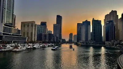 a group of boats in a harbor in a city at JBR Marina View - 2BR Apartment in Dubai