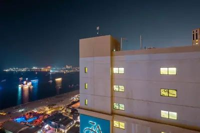 a tall white building with a view of the water at Frank Porter - Shams 4 in Dubai