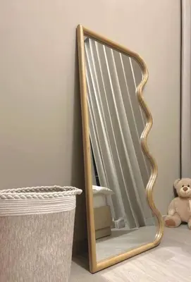 a mirror next to a trash can with a teddy bear at Cozy urban stay near Dubai Mall in Dubai