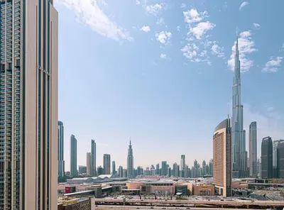 a view of a city skyline with tall buildings at Stunning Burj Khalifa Views - Dubai Mall Access - Infinity Pool - MaxStays in Dubai