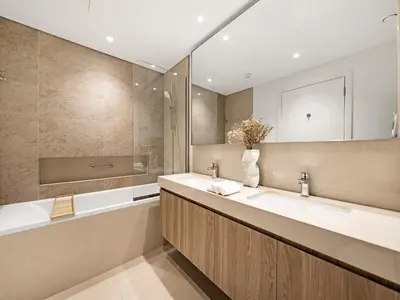 a bathroom with two sinks and a mirror at Blissful Stays - Luxury Two Bedroom Apartment at Downtown Views II- 5 min walk to Dubai Mall, Burj Khalifa with Infinity Pool in Dubai