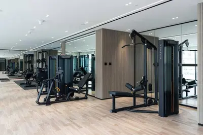a gym with treadmills and ellipticals in a building at Stylish 1br Apartment Jvc Balcony Parking in Dubai