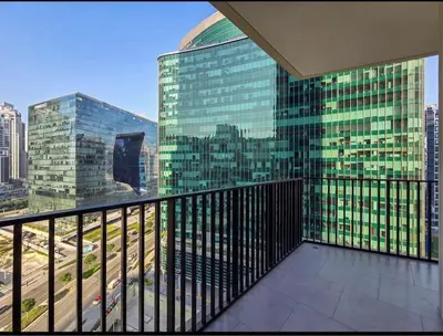 a balcony with a view of a city at FIRST CLASS 1BR Charming City in Dubai