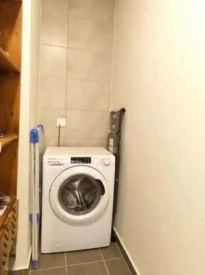 a washer and dryer in a small room at Cozy 2BR Apartment DAMAC VERA Business Bay in Dubai