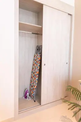 a room with a closet with a ladder in it at Seven Palm Residences Palm Jumeirah by Happy Season in Dubai