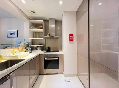 a kitchen with a sink and a counter top at Luxurious & Modern 1BR DAMAC Paramount Business Bay in Dubai