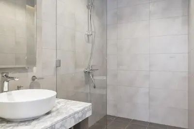 a bathroom with a sink and a shower at Samani vacation Homes 5701 in Dubai