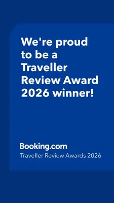 a blue sign that says were proud to be a traveller reviewagency winner at Address Residence Dubai Opera 25 by Luxstay Holiday Homes in Dubai