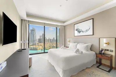a hotel room with a bed and a large window at Address Residence Dubai Opera 25 by Luxstay Holiday Homes in Dubai