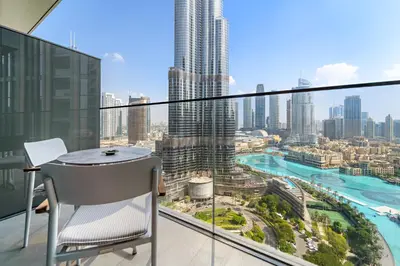a balcony with a table and a view of a city at Address Residence Dubai Opera 25 by Luxstay Holiday Homes in Dubai