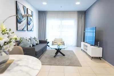 a living room with a couch and a tv at Elite Residences Tower Dubai Marina by Happy Season in Dubai
