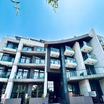 a large building with balconies on the side of it at Modern 1-Bedroom La Perla Apartment JVC with Infinity Pool & Kids’ Zone in Dubai
