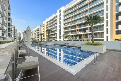 a swimming pool in the middle of a building at Studio Azizi Riviera 28 Community View in Dubai