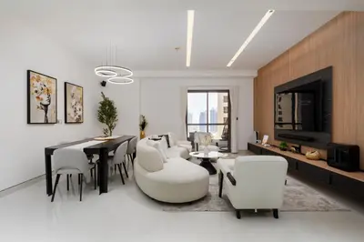 a living room with white furniture and a fireplace at Bahar, Jumeirah Beach Residence JBR - Mint Stay in Dubai