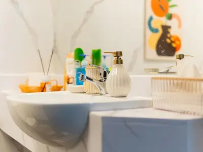 a bathroom with a sink and a mirror at Serene 1BR in Diamond Views 3 JVC - Pool Access & Peaceful Living , Managed by Think Realty in Dubai