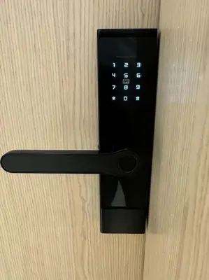 a black remote control hanging on a wall at Luxury Studio apartment in JVC, Oakley Square Residences in Dubai