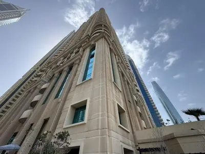 a tall building with windows on top of it at Marina Crown 1 BR Modern Apartment Full Sea View in Dubai