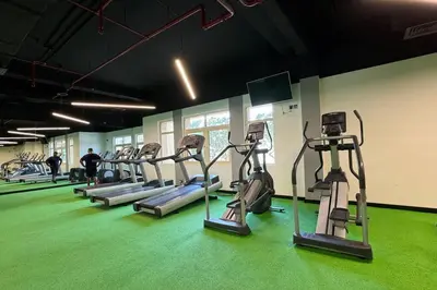 a row of tread machines in a gym at Sophisticated 3 Bed Palm Jumeirah w Beach Access in Dubai