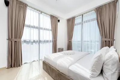 a bedroom with a white bed and large windows at Chic 2BR Apartment in Dubai Marina, near Marina Beach and The Walk in Dubai