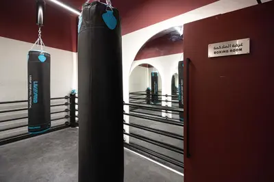a gym with a large black punching bag in a room at UrbanHomes - Cozy Spacious Exceptional Studio in Heart of Dubai at JVC in Dubai