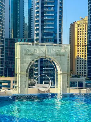 a view of a pool in a city with tall buildings at Luxury Apartments - Stunning Marina View - 5-Star Hotel Amenities in Dubai