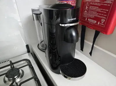a coffee maker sitting on top of a stove at Chic 1BR Retreat , Blvd Views, Walk to Dubai Mall in Dubai