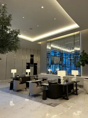 a lobby with chairs and tables in a building at The Address Downtown Studio 1911 in Dubai