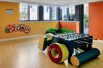 a play room with a lego table and a chessboard at Downtown Studio with Balcony at 29Blvd in Dubai