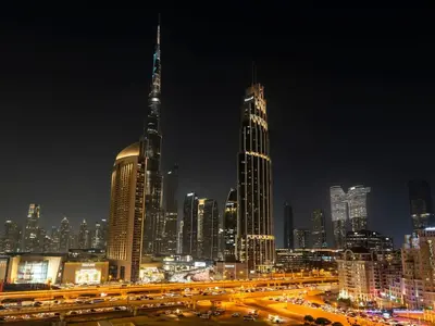 a view of a city at night with traffic at UrbanStays Dubai - Downtown Views II in Dubai