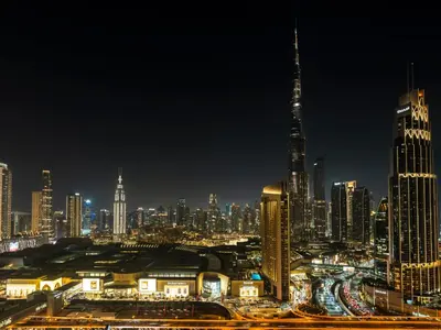a city skyline at night with a tall building at UrbanStays Dubai - Downtown Views II in Dubai