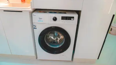 a washer and dryer in a white cabinet at USMANS 3 Bedroom Apartment all Rooms Sea View Direct Beach Access Daily HOUSEKEEPING JBR in Dubai