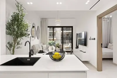 a kitchen with a bowl of fruit on a counter at Binghatti Canal Business Bay in Dubai