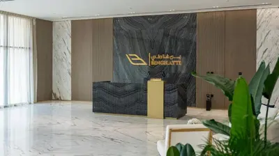 a lobby with a stage in the middle of a room at Elegant 1br Escape Jvc Pool & Balcony Access in Dubai