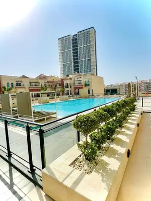 a swimming pool on the roof of a building at Modern Luxury Fully Furnished 1BH Apartment in Binghatt Emerald JVC - Easy Access to JBR, Circle Mall & Dubai Hills Mall in Dubai