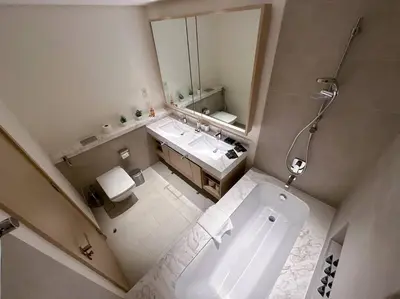 an overhead view of a bathroom with a tub and sink at Luxurious 3BR - Pool - Canal View - Kids Play Area in Dubai