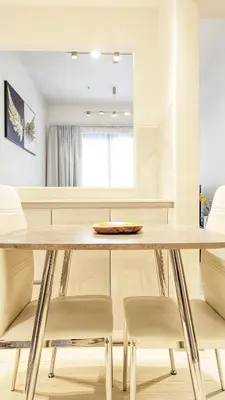 a dining room with a table and chairs at Modern Luxury Fully Furnished 1BH Apartment in Binghatt Heights JVC - Easy Access to JBR, Circle Mall & Dubai Hills Mall in Dubai