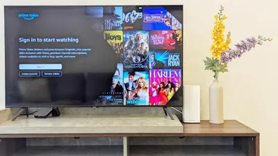 a flat screen tv sitting on top of a table at Modern Luxury Fully Furnished 1BH Apartment in Binghatt Heights JVC - Easy Access to JBR, Circle Mall & Dubai Hills Mall in Dubai